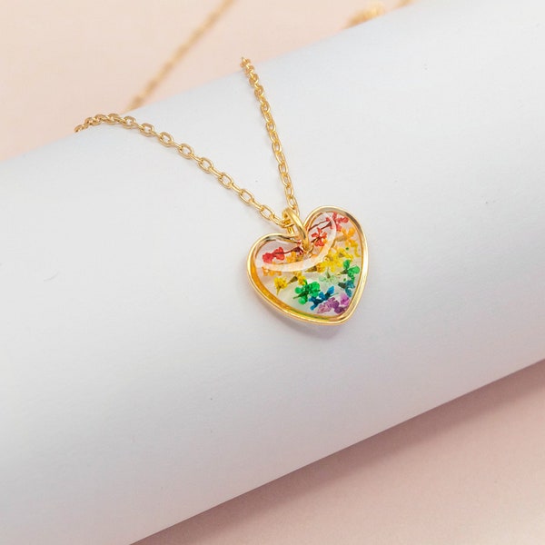 subtle queer pride dainty rainbow heart necklace with real flowers in resin, minimalist discreet lgbt flag jewellery