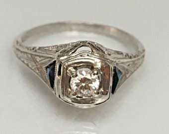 Certified 1920s Art Deco Platinum 1/6 Carat Diamond American Filigree Ring