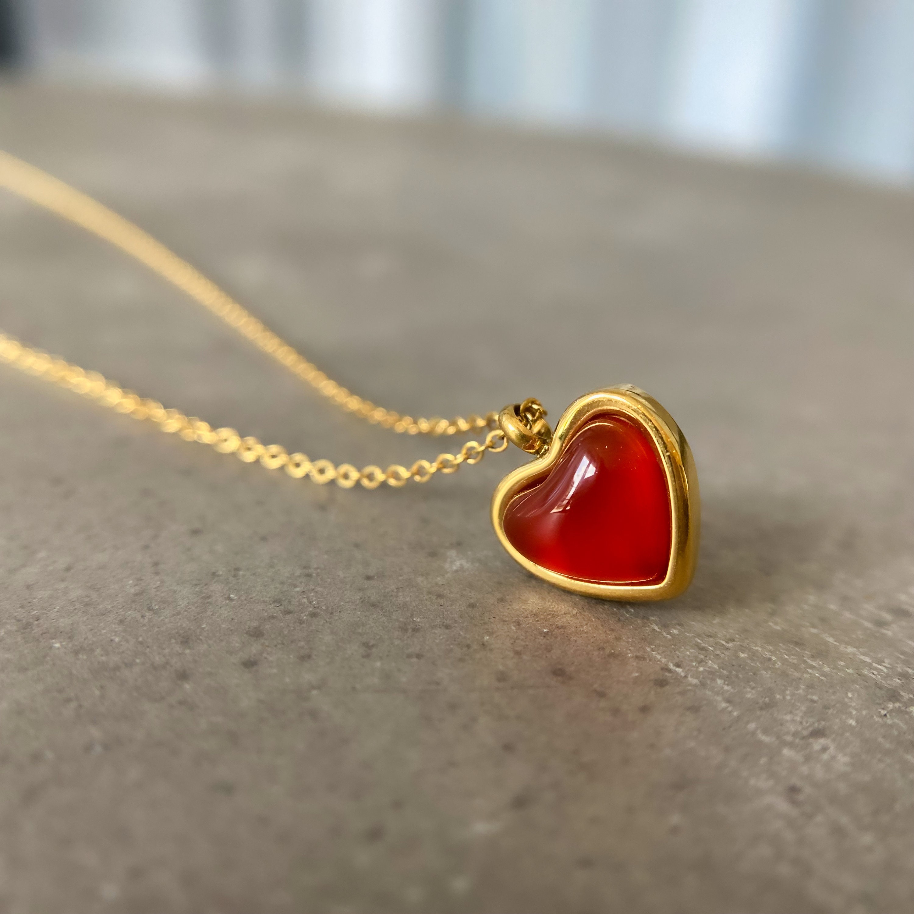 Gold necklace with red cheap heart