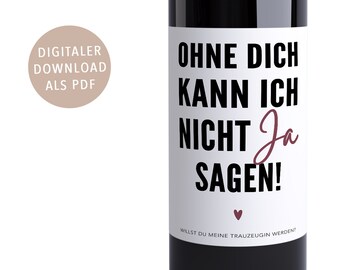 May include: A white wine bottle label with black text that reads "Ohne dich kann ich nicht Ja sagen!" and a small heart. The text below the heart reads "Willst du meine Trauzeugin werden?"