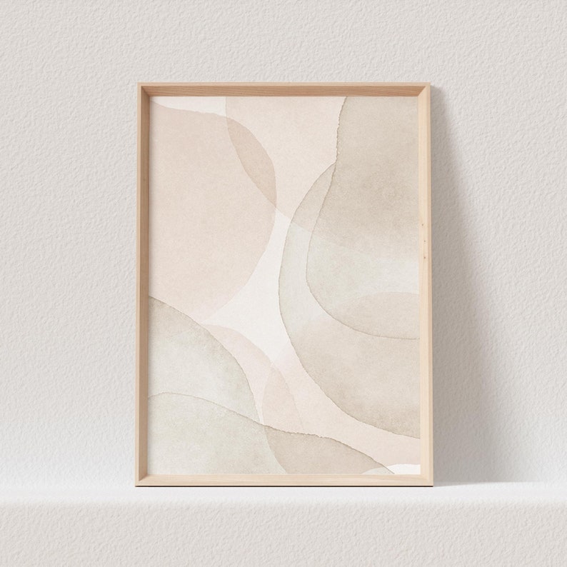 May include: A framed abstract print with a beige and light green watercolor design. The print features overlapping circles and organic shapes.