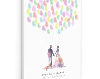 Puede incluir: Impresión en lienzo blanco con una ilustración en acuarela de una pareja tomados de la mano, con globos de huellas dactilares de colores flotando encima. Los nombres "SVENJA & DANIEL" y la fecha "20. AGOSTO 2026" están impresos debajo.