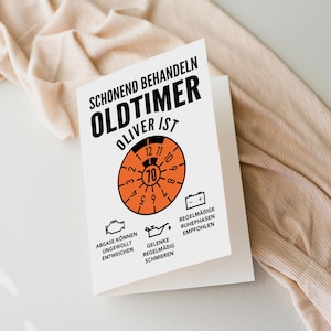 May include: A white card with black text that reads "Schonend Behandeln Oldtimer Oliver ist" with an orange speedometer graphic and text that reads "Abgase konnen ungewollt entweichen, Gelenke regelmabig schmieren, Regelmabige Ruhephasen empfohlen".