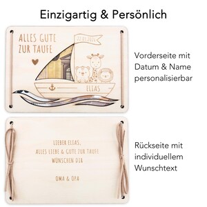 K&ouml;nnte beinhalten: Holzkiste mit einem Schlitz f&uuml;r Geld, verziert mit einem Segelboot und Tieren. Die Vorderseite der Kiste lautet "Alles Gute zur Taufe" und "Elias". Die R&uuml;ckseite der Kiste lautet "Lieber Elias. Alles Liebe & Gute zur Taufe W&uuml;nschen Dir Oma & Opa".