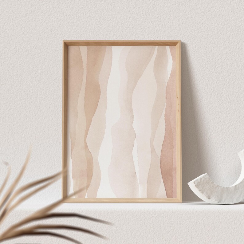 May include: A framed abstract print with a watercolour design of wavy lines in shades of brown and beige.