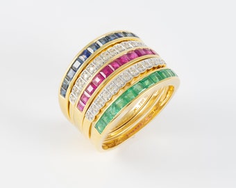 Infinity ring in 18k yellow gold with diamonds, sapphires, rubies and emeralds.