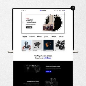 May include: A laptop screen showing a website selling camera equipment. The top section advertises a Leica Q3 Monochrome camera. Below are product images of digital cameras, video cameras, lighting, and other photography accessories. The website text reads "Go Anywhere & Shoot Anywhere with Ease."