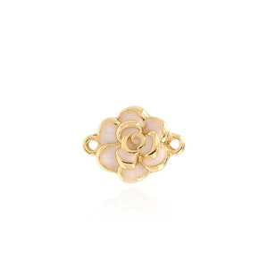 May include: Gold-tone flower charm with a white enamel finish. The charm has two loops on the back for attaching to a necklace or bracelet.