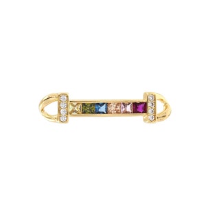 May include: A gold bar charm with a row of colorful square gemstones and clear round stones on each end.