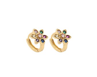 May include: A pair of gold hoop earrings with a flower design. The flower has a center stone and six surrounding stones in various colors, including pink, blue, green, and purple.