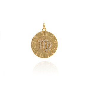 May include: Gold-toned zodiac pendant featuring the Virgo constellation with clear rhinestones. The pendant is round and has a textured surface. The outer edge of the pendant features the zodiac symbols for each sign.