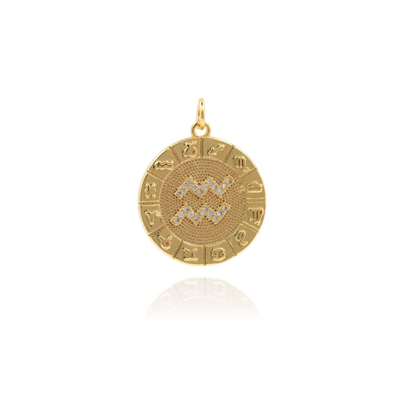 May include: Gold zodiac pendant featuring the Aquarius symbol with clear rhinestones. The pendant is round and has all 12 zodiac signs around the edge.