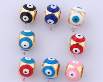 Puede incluir: Ocho cuentas doradas con esmalte de diferentes colores y un diseño de ojo turco blanco. Las cuentas están numeradas del 1 al 8.
