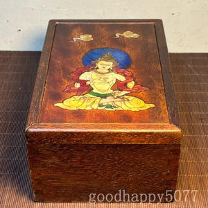 Utdragbar låda med Buddha-staty i trä med inläggningar