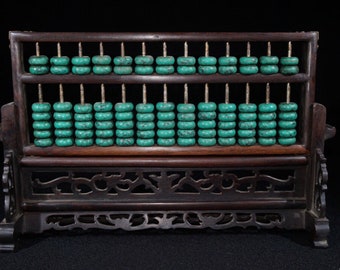 A beautifully carved mahogany abacus.