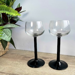 Pair of vintage Luminarc France black stem wine glasses