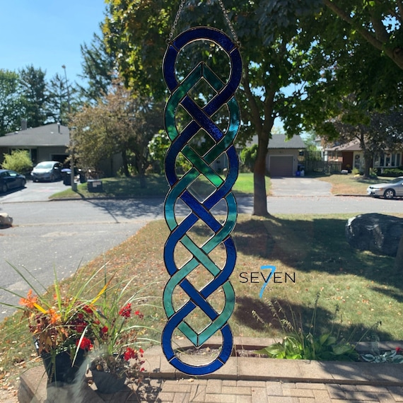 Celtic Sailors Knot Stained Glass Suncatcher.  Vertical Window Hanging in Bright Lightly Textured Blue and Turquoise