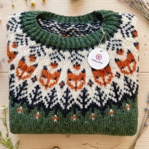 Folded: Lyme Grass Green Hand-knitted Icelandic wool Into the Wild sweater with a fox yoke pattern, made from genuine Icelandic wool by Knitting.Tallinn.