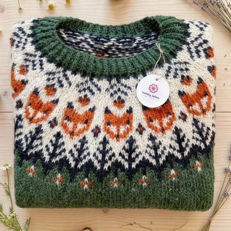 Folded: Lyme Grass Green Hand-knitted Icelandic wool Into the Wild sweater with a fox yoke pattern, made from genuine Icelandic wool by Knitting.Tallinn.