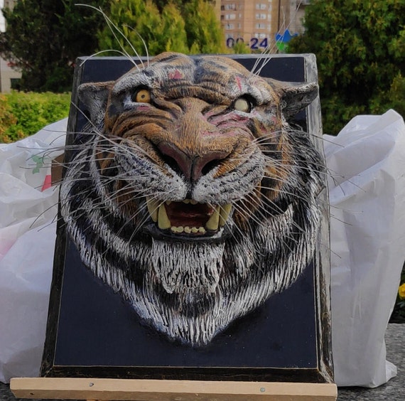 Escultura de tigre, ojo del tigre Escultura de tigre, ojo del tigre