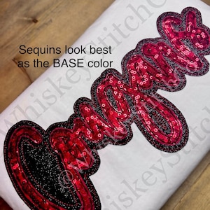 May include: A white t-shirt with a red sequined word "Cami" on it. The text "Sequins look best as the BASE color" is written in white on the shirt.