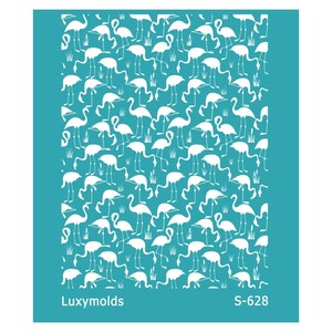 May include: A turquoise blue stencil with a repeating pattern of white flamingo silhouettes. The stencil is labeled "Luxymolds S-628".