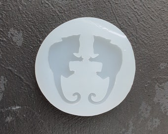 May include: White silicone mold with two cat silhouettes facing each other. The cats are in a sitting position with their tails curled around each other.