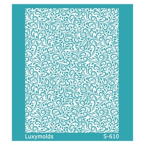 May include: A teal blue stencil with a repeating pattern of swirling leaves and vines. The stencil is labeled "Luxymolds S-610".