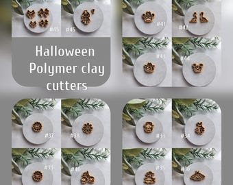 May include: A set of 10 Halloween-themed polymer clay cutters. The cutters are made of wood and feature various designs, including a ghost, a bat, a pumpkin, a witch's hat, a spider, a skull, a cat, a spider web, a flower, and a cherry. The cutters are numbered 33 through 44.