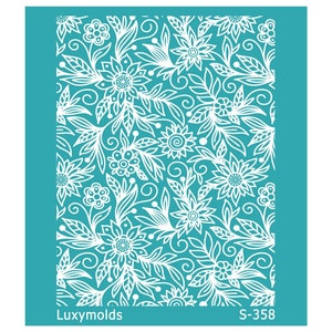 May include: A white stencil with a floral design on a turquoise background. The stencil is labeled "Luxymolds S-358".