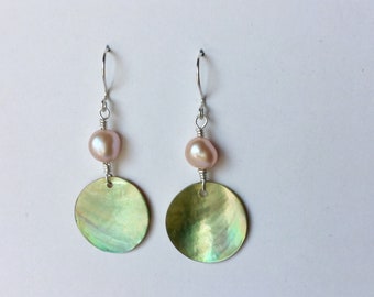 Iridescent green shell discs and pearl dangling earrings with Sterling Silver ear wires.