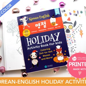 May include: A blue and white activity book for kids with the title "Korean-English Holiday Activity Book for Kids". The book features a panda wearing a Santa hat and a fox wearing a chef's hat. The book includes coloring, dot-to-dot, mazes, and more. The book is printed with the text "STELLARSOL CREATIVE LEARNING PRINTED MADE WITH" in a pink circle.