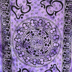 May include: Purple tapestry with a mandala design featuring the Om symbol in black. The mandala is surrounded by a border of Om symbols.