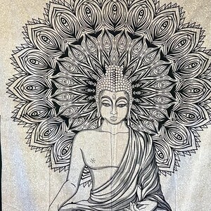 May include: A black and white mandala tapestry featuring a meditating Buddha with a detailed design. The mandala is a circular pattern with intricate details and the Buddha is sitting in a meditative pose with his hands in his lap.