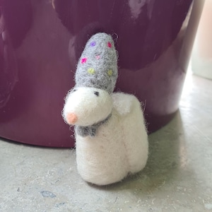 Felt figure mouse giving money
