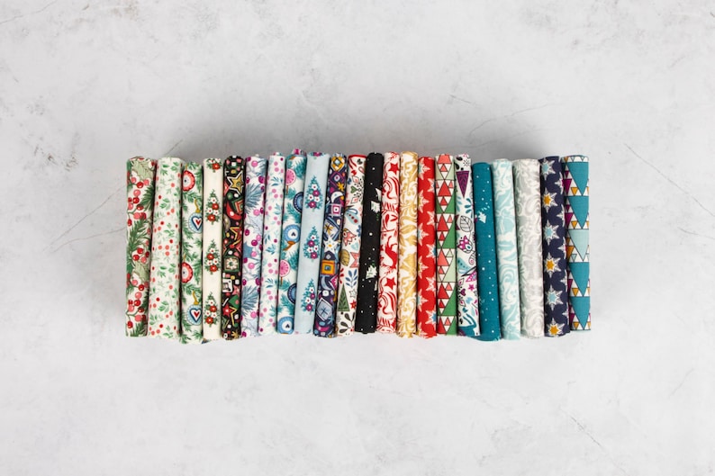 May include: A collection of 20 fabric scraps featuring a variety of festive patterns, including snowflakes, stars, trees, and baubles. The fabrics are in a range of colours, including red, green, blue, white, and gold.
