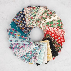 May include: A collection of 20 fabric squares featuring a variety of Christmas-themed patterns, including snowflakes, trees, and reindeer. The squares are arranged in a circle, with the colours red, green, blue, white, and gold.