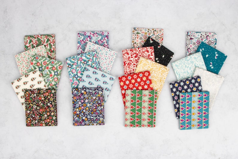 May include: A collection of 20 fabric squares featuring a variety of Christmas-themed patterns. The squares are arranged in four rows of five, with each row showcasing a different colour scheme. The patterns include stars, snowflakes, trees, and other festive designs. The fabrics are a blend of cotton and linen.