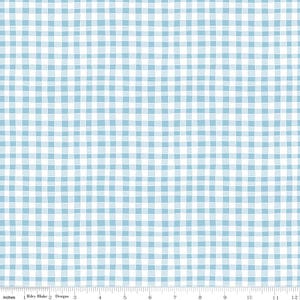 May include: A light blue and white gingham fabric pattern featuring hand-drawn style intersecting lines. A ruler at the bottom edge shows a scale of 12 inches, with the text Riley Blake Designs printed near the one-inch mark on the white border.
