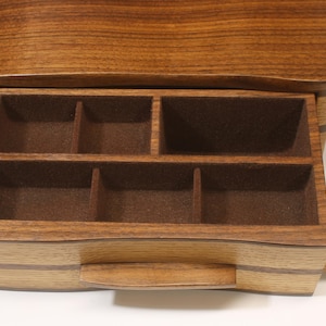 Unique one drawer custom crafted band saw box with several hidden slide out mini drawers/trays made out of solid oak and walnut.