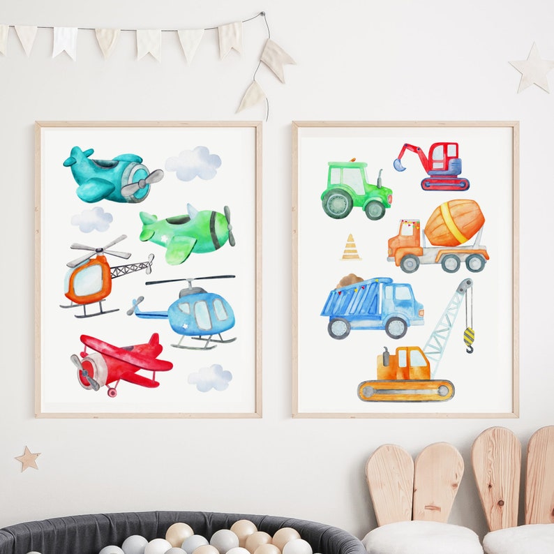 May include: Two framed watercolor prints featuring transportation vehicles. One print showcases airplanes and helicopters in various colors. The other print displays construction vehicles, including a tractor, dump truck, and crane.