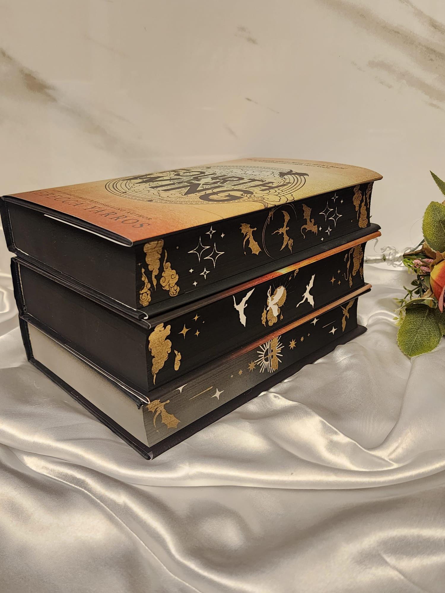 Fourth Wing, Iron Flame and Onyx Storm with stenciled edges