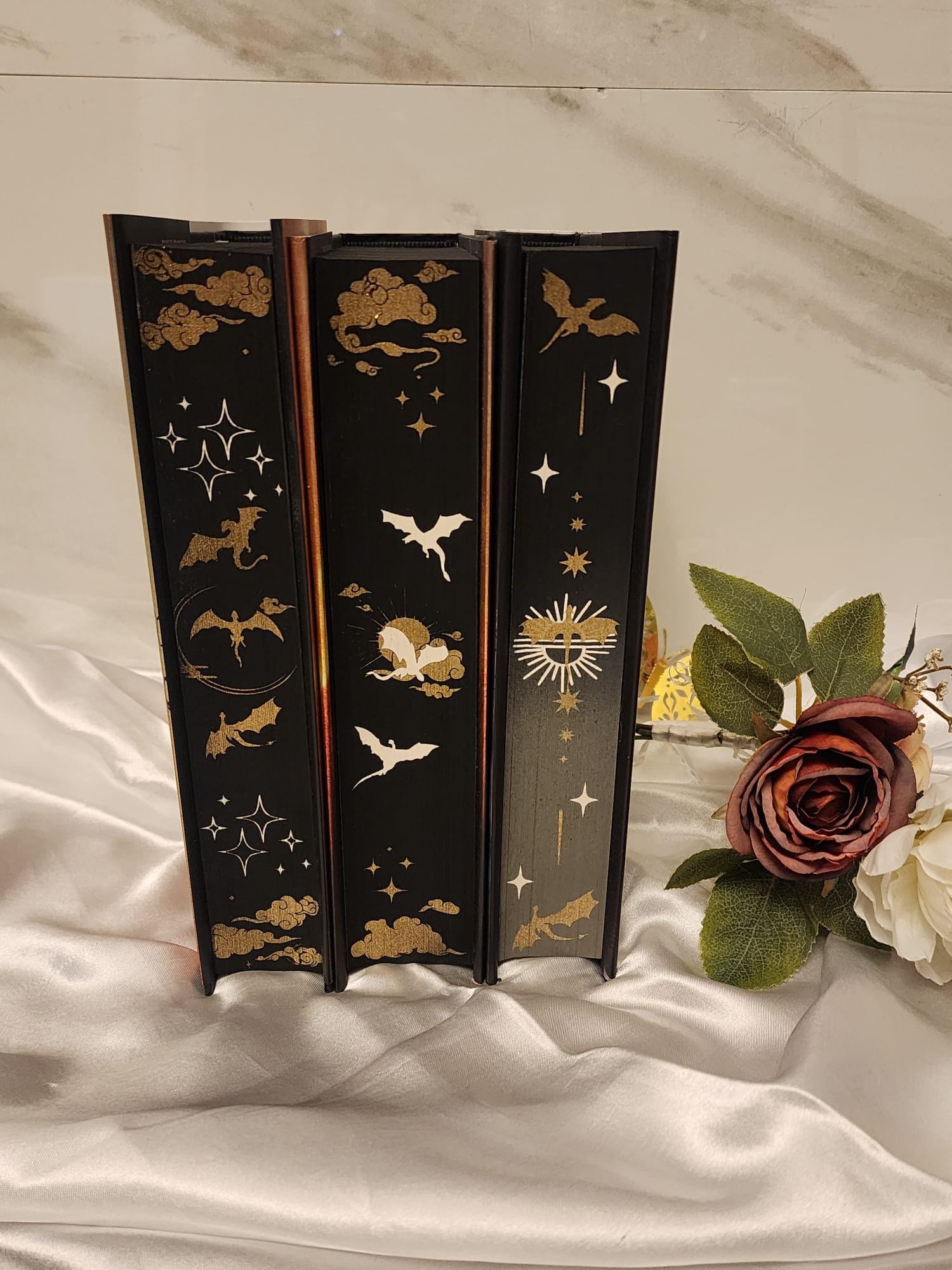 Fourth Wing, Iron Flame and Onyx Storm with stenciled edges