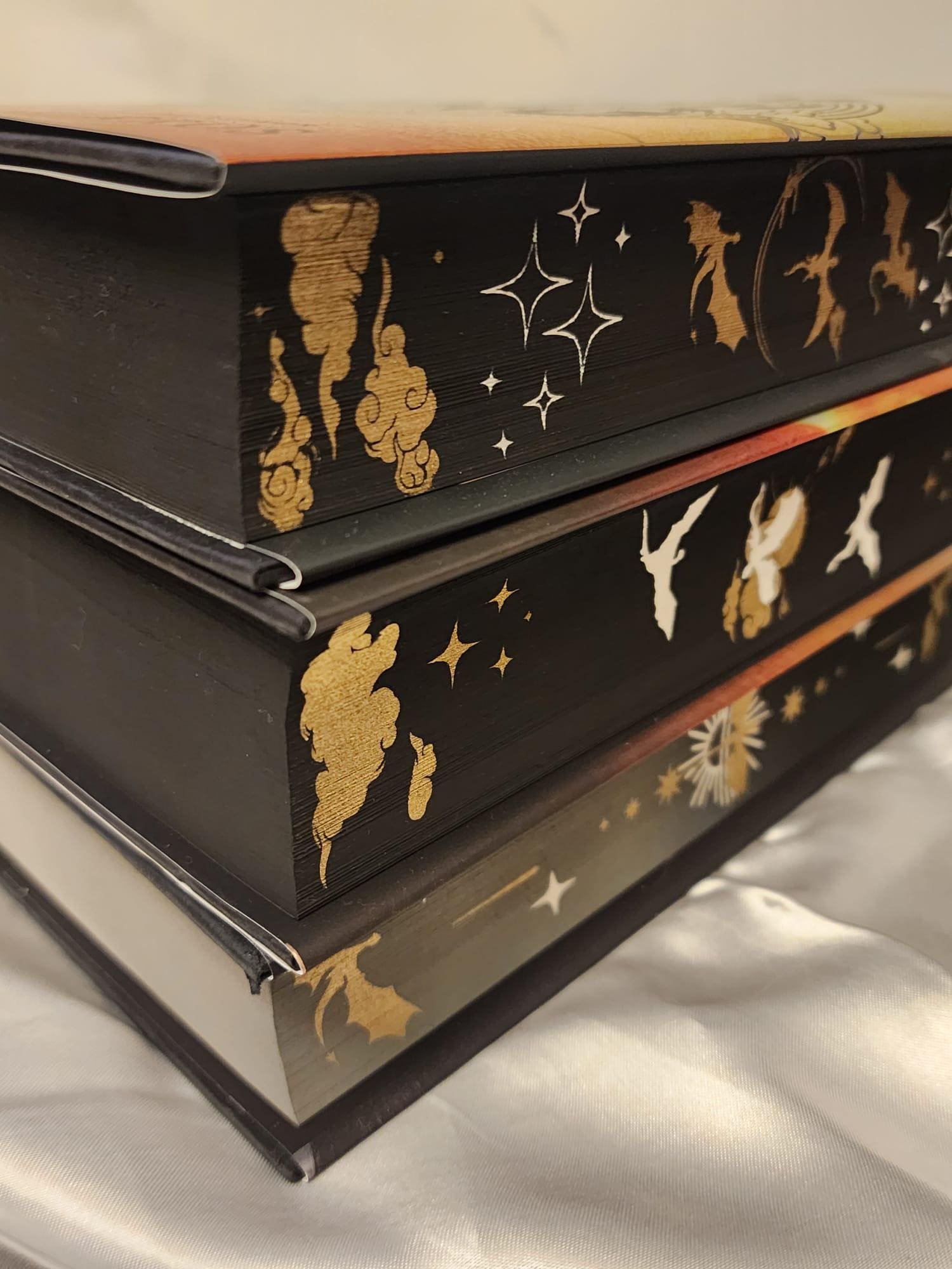 Fourth Wing, Iron Flame and Onyx Storm with stenciled edges