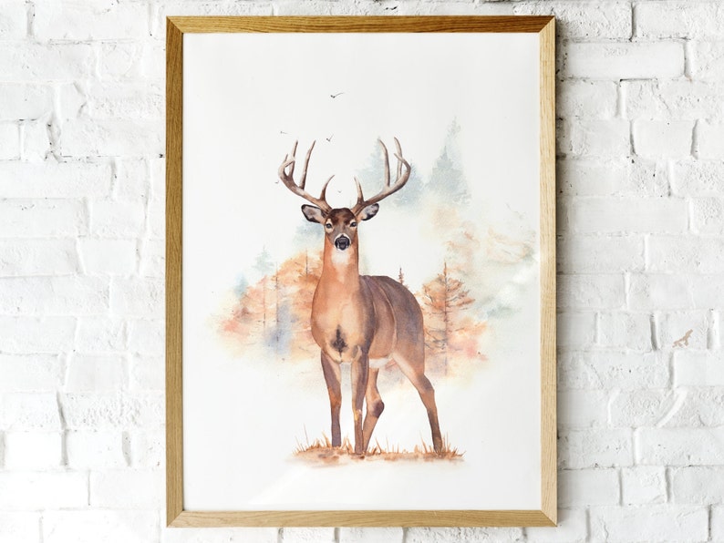 May include: Watercolor painting of a brown deer with large antlers standing in a forest setting. The background is a soft watercolor wash of brown, orange, and green.