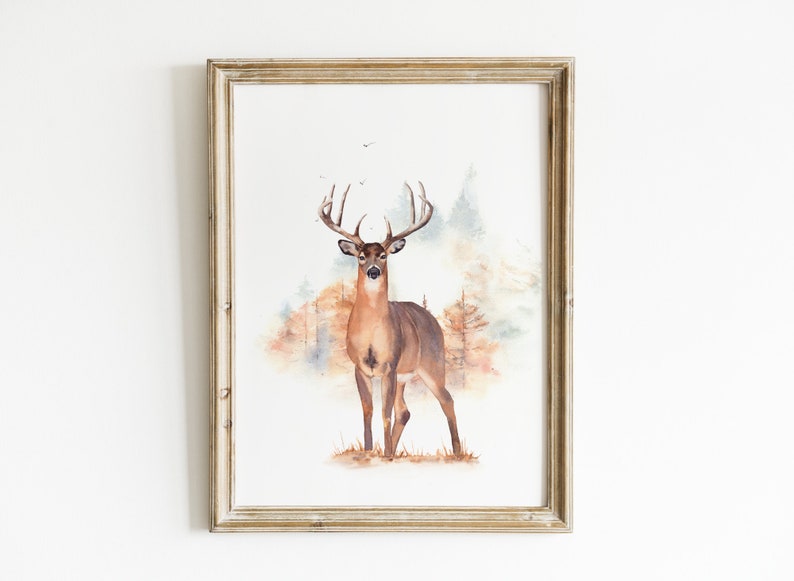May include: Watercolor painting of a brown deer with large antlers standing in a forest setting. The background is a soft watercolor wash of blue, green, and brown.