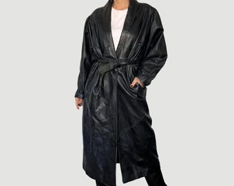 May include: A long black leather coat with a belt and a shawl collar.
