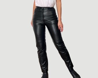 May include: Black leather pants with a high waist and a slim fit.