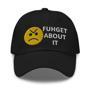 May include: Black baseball cap with a yellow frowning emoji and the text "FUHGET ABOUT IT" embroidered in white.
