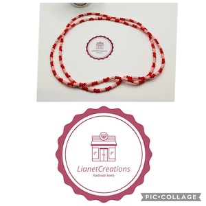 May include: A beaded necklace with alternating red and pink beads. The necklace is displayed on a white surface, with a circular logo that reads "LianetCreations Handmade Jewely".